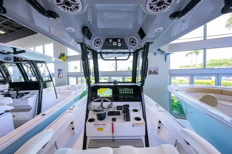 Slide: The Image of 2026 Sportsman Masters 247OE Bay Boat interior with modern dashboard and controls. - 14