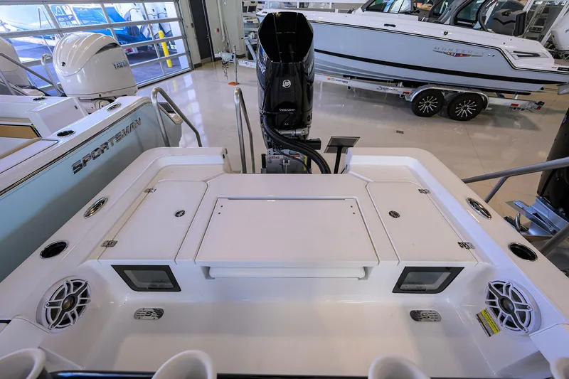 Slide: The Image of 2026 Sportsman Masters 247OE Bay Boat interior with motor and storage compartments. - 22
