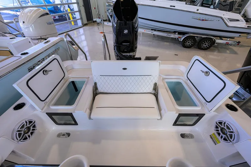 Slide: The Image of 2026 Sportsman Masters 247OE Bay Boat interior with storage compartments and seating. - 23