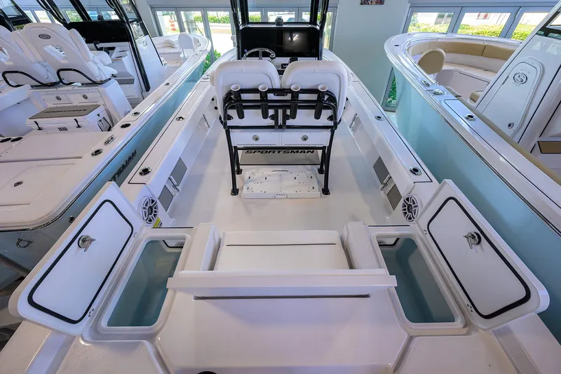 Slide: The Image of 2026 Sportsman Masters 247OE Bay Boat interior with seating and storage compartments. - 24