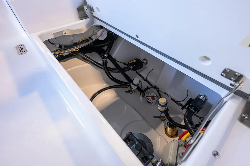 Slide: The Image of 2026 Sportsman Masters 247OE Bay Boat interior wiring and plumbing details. - 26