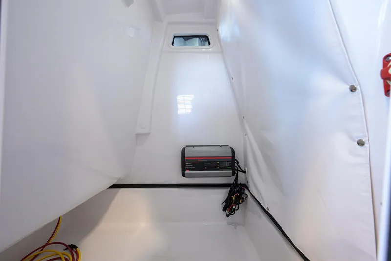 Slide: The Image of Interior of 2026 Sportsman Masters 247OE Bay Boat showing electrical components and wiring. - 27