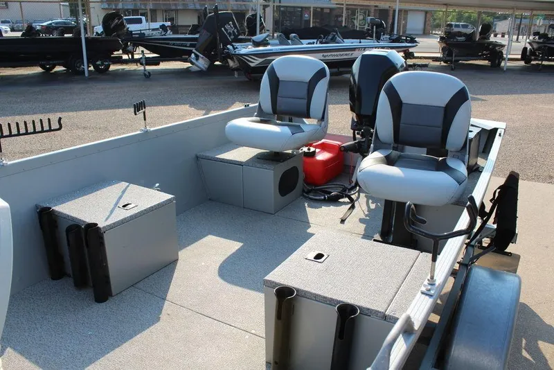 Slide: The Image of 2022 Alumacraft V14 boat interior with seating and storage compartments. - 7
