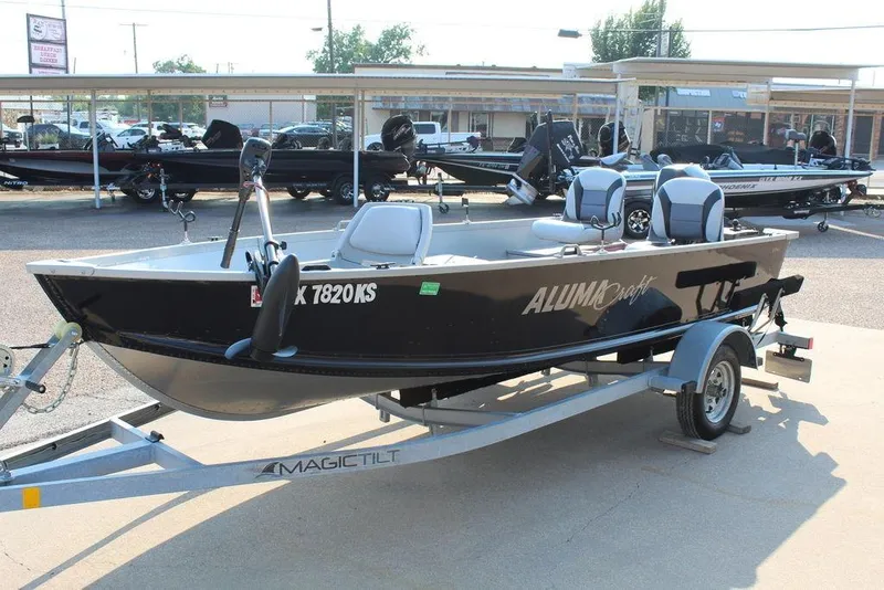 Slide: The Image of 2022 Alumacraft V14 boat on trailer in outdoor dealership lot. - 8