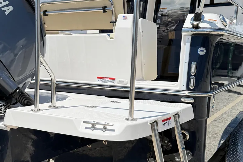 Slide: The Image of 2025 Ranger Tugs R-23 boat stern with swim platform and ladder. - 10