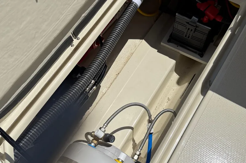 Slide: The Image of Interior view of 2025 Ranger Tugs R-23 boat showing mechanical components and wiring. - 19