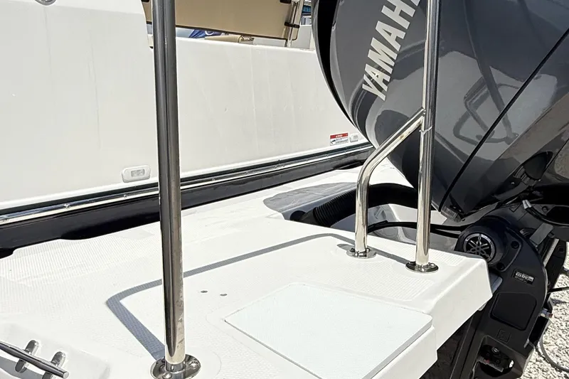 Slide: The Image of 2025 Ranger Tugs R-23 boat with Yamaha engine, featuring stainless steel railings. - 7