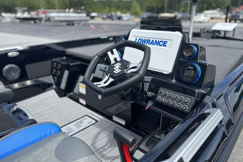 Slide: The Image of 2026 Bass Cat Puma STS boat dashboard with Lowrance electronics and modern controls. - 13