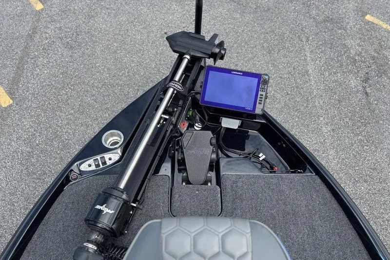 Slide: The Image of 2026 Bass Cat Puma STS boat dashboard with navigation system and controls. - 18