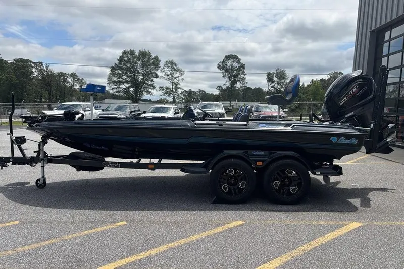 Slide: The Image of 2026 Bass Cat Puma STS boat on trailer in parking lot, side view. - 5
