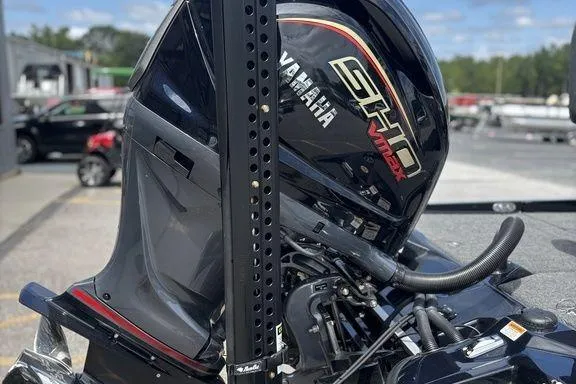 Slide: The Image of 2026 Bass Cat Puma STS with Yamaha SHO VMAX outboard motor, parked outdoors. - 8