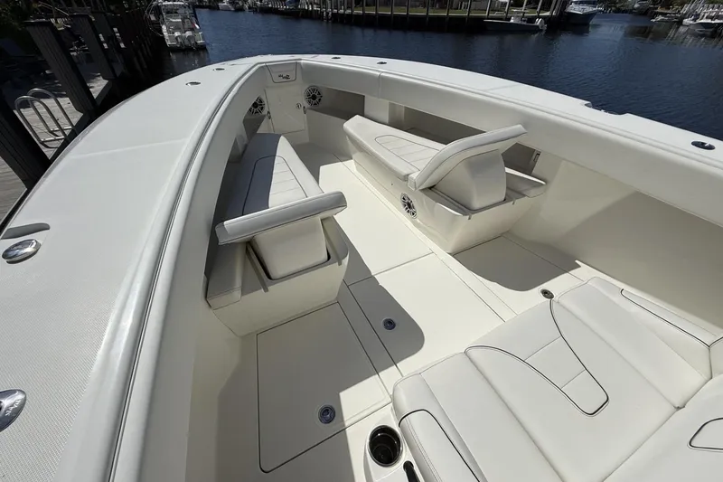 Slide: The Image of 2021 SeaVee 37 boat interior with white seating and spacious deck. - 12
