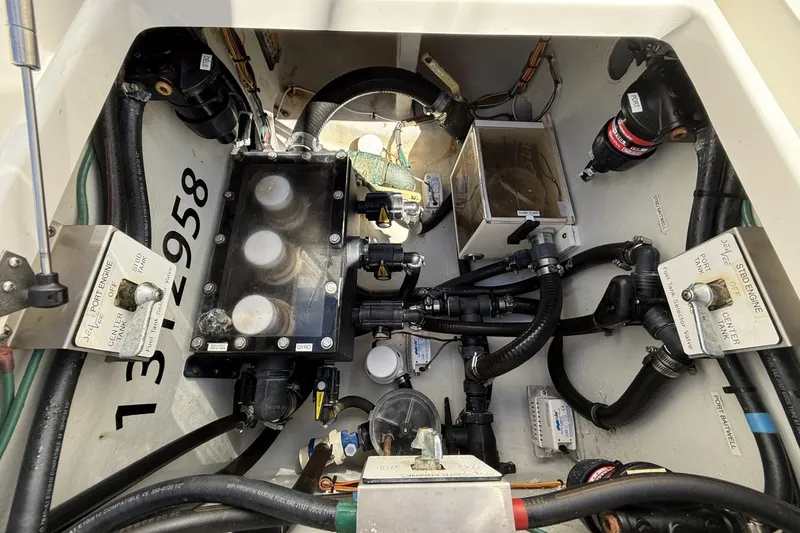 Slide: The Image of Engine compartment of a 2021 SeaVee 37 boat, showcasing complex mechanical components. - 13