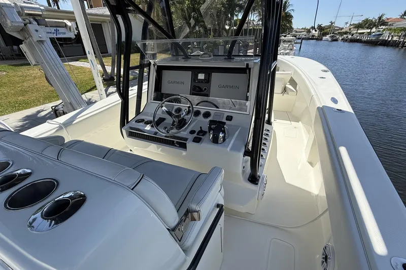 Slide: The Image of 2021 SeaVee 37 boat cockpit with Garmin navigation, sleek design, and spacious seating. - 8