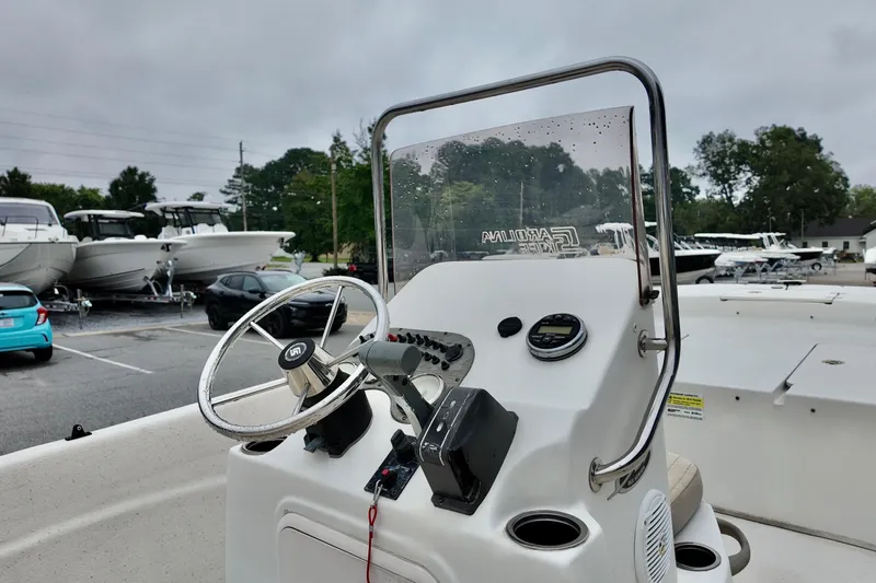 Slide: The Image of 2016 Carolina Skiff Standard 2180 boat console with steering wheel and controls. - 5
