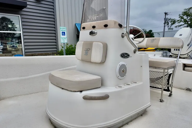 Slide: The Image of 2016 Carolina Skiff Standard 2180 boat interior with seating and steering console. - 8
