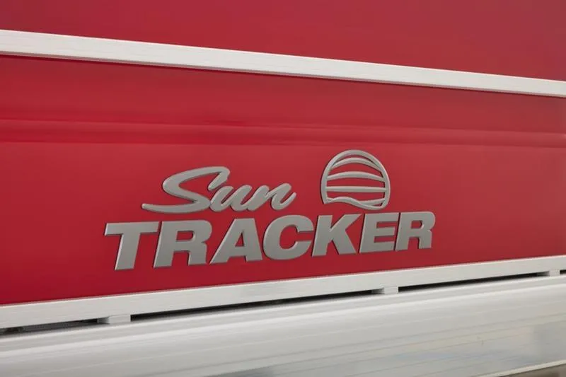Slide: The Image of Red Sun Tracker Party Barge 22 DLX 2026 logo on boat exterior. - 17