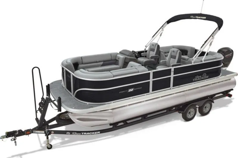 Slide: The Image of 2026 Sun Tracker Party Barge 22 DLX pontoon boat on trailer, side view. - 2