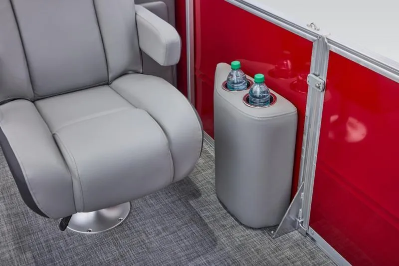 Slide: The Image of 2026 Sun Tracker Party Barge 22 DLX interior with gray seat and cup holders. - 25