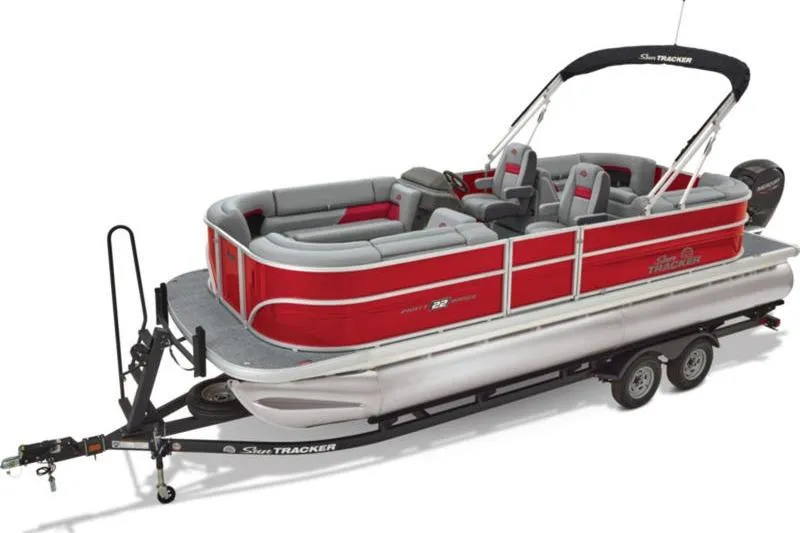 Slide: The Image of 2026 Sun Tracker Party Barge 22 DLX pontoon boat on trailer, red and gray design. - 3