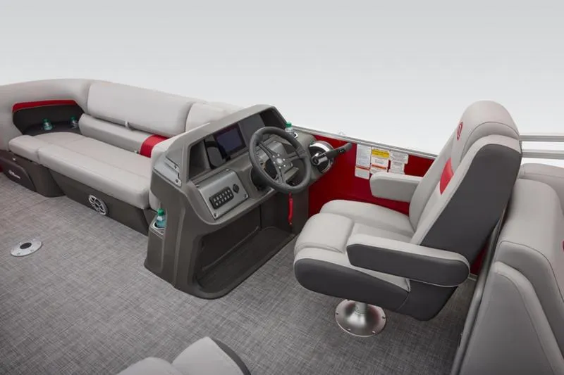Slide: The Image of 2026 Sun Tracker Party Barge 22 DLX interior with helm and seating area. - 30