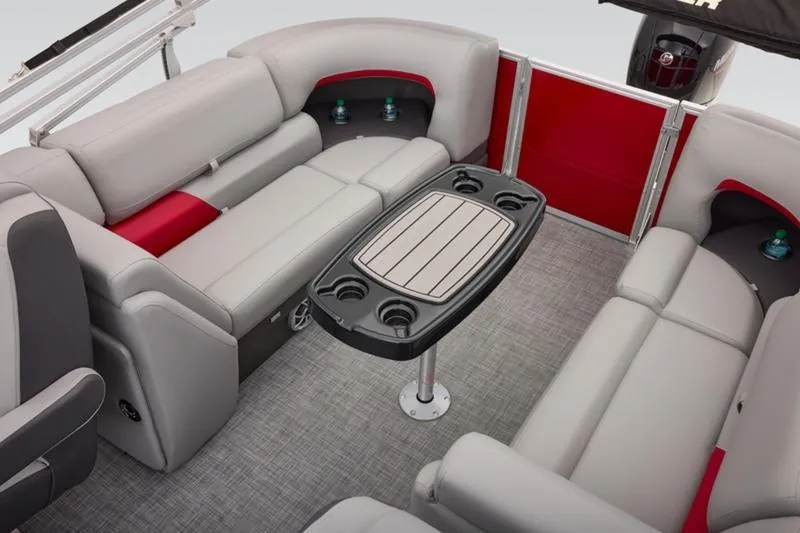 Slide: The Image of 2026 Sun Tracker Party Barge 22 DLX interior with plush seating and central table. - 40