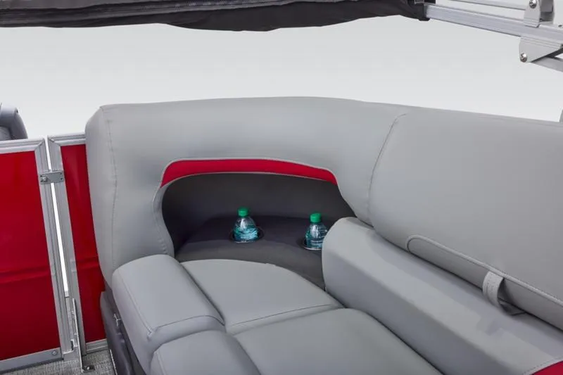 Slide: The Image of 2026 Sun Tracker Party Barge 22 DLX interior with gray seating and cup holders. - 43