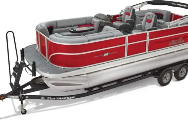 Slide: The Image of 2026 Sun Tracker Party Barge 22 DLX pontoon boat on trailer, red and gray design. - 8