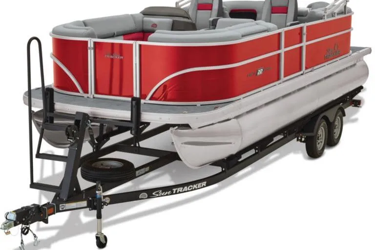 Slide: The Image of 2026 Sun Tracker Party Barge 22 DLX pontoon boat on trailer, red and gray design. - 9