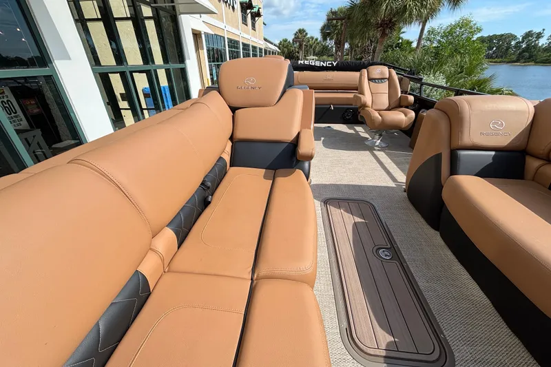 Slide: The Image of Luxurious interior of 2025 Regency 250 LE3 Sport boat with tan leather seating. - 17