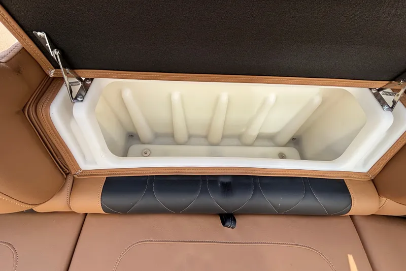 Slide: The Image of Open storage compartment in 2025 Regency 250 LE3 Sport boat seat. - 15
