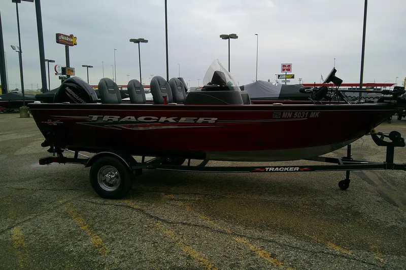 Slide: The Image of 2023 Tracker Pro Guide V-16 SC boat on trailer in parking lot. - 3