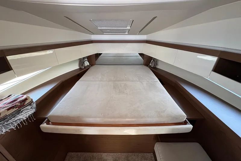 Slide: The Image of 2019 Jeanneau NC 33 cabin interior with spacious bed and modern design. - 17