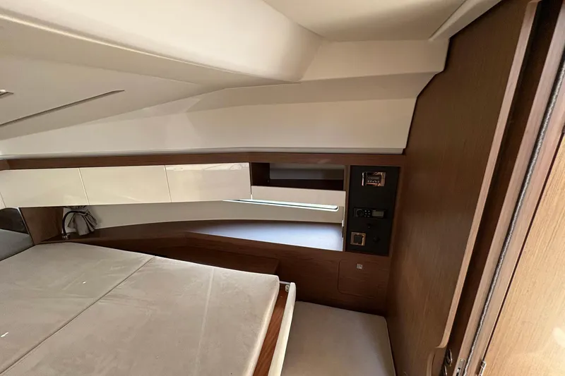 Slide: The Image of Interior cabin of 2019 Jeanneau NC 33 yacht with modern wood finish. - 18