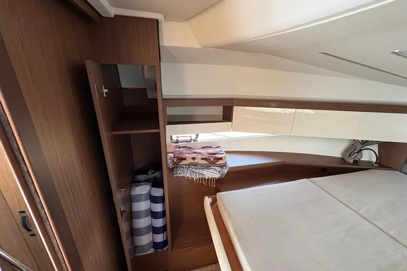 Slide: The Image of Interior cabin of 2019 Jeanneau NC 33 boat with bed and storage. - 19