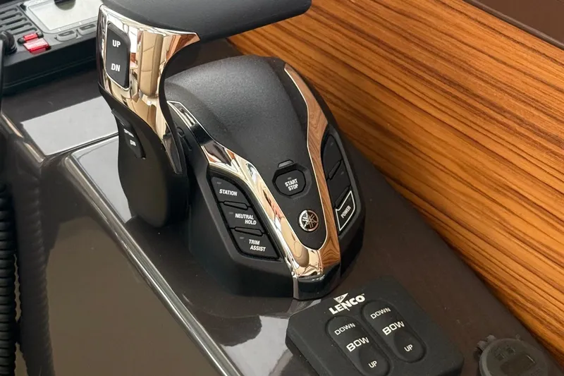 Slide: The Image of Control panel of 2025 Ranger Tugs R-25 boat with modern throttle and trim controls. - 21