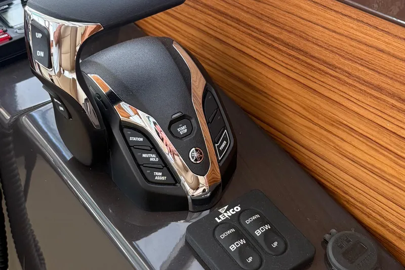 Slide: The Image of Control panel of 2025 Ranger Tugs R-25 boat with Yamaha throttle and Lenco trim tabs. - 24