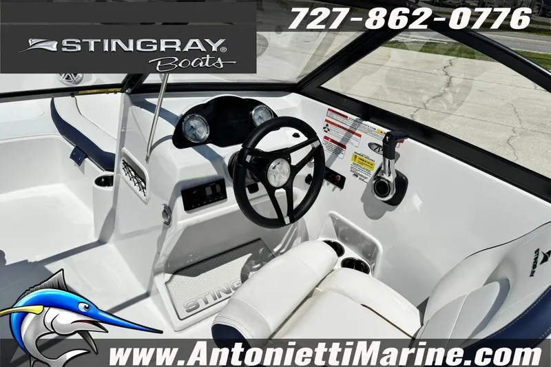 Slide: The Image of 2026 Stingray 191DC Dual Console boat interior with steering wheel and controls. - 11