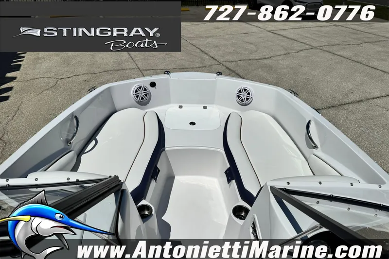 Slide: The Image of 2026 Stingray 191DC Dual Console boat interior with seating and speakers, Antonietti Marine branding. - 15