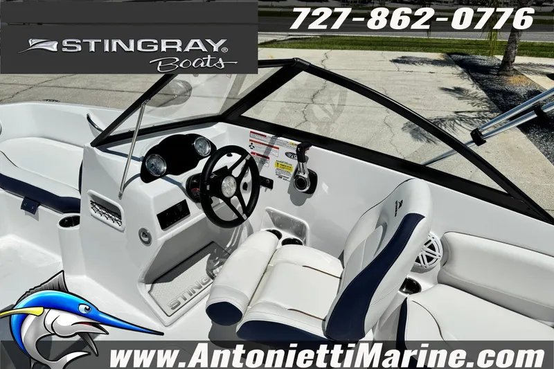 Slide: The Image of 2026 Stingray 191DC Dual Console boat interior with steering wheel and seating. - 26