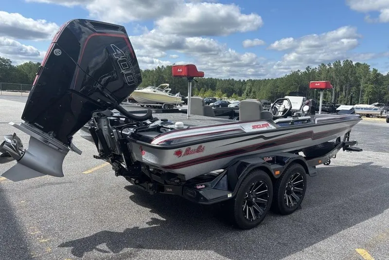 Slide: The Image of 2026 Bass Cat Jaguar STS boat with powerful outboard motor on a trailer. - 1