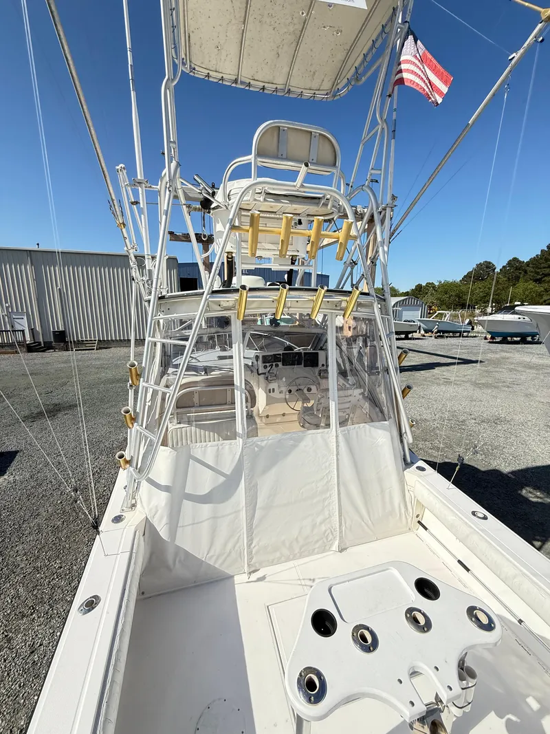 Slide: The Image of 2001 Albemarle 280 Express Sport Fisherman boat with diesel power, featuring a fishing tower and rod holders. - 10