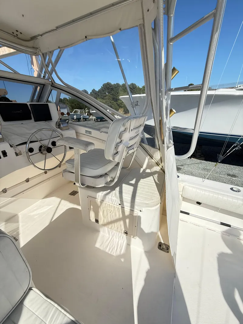 Slide: The Image of 2001 Albemarle 280 Express Sport Fisherman boat interior with helm and seating. - 14