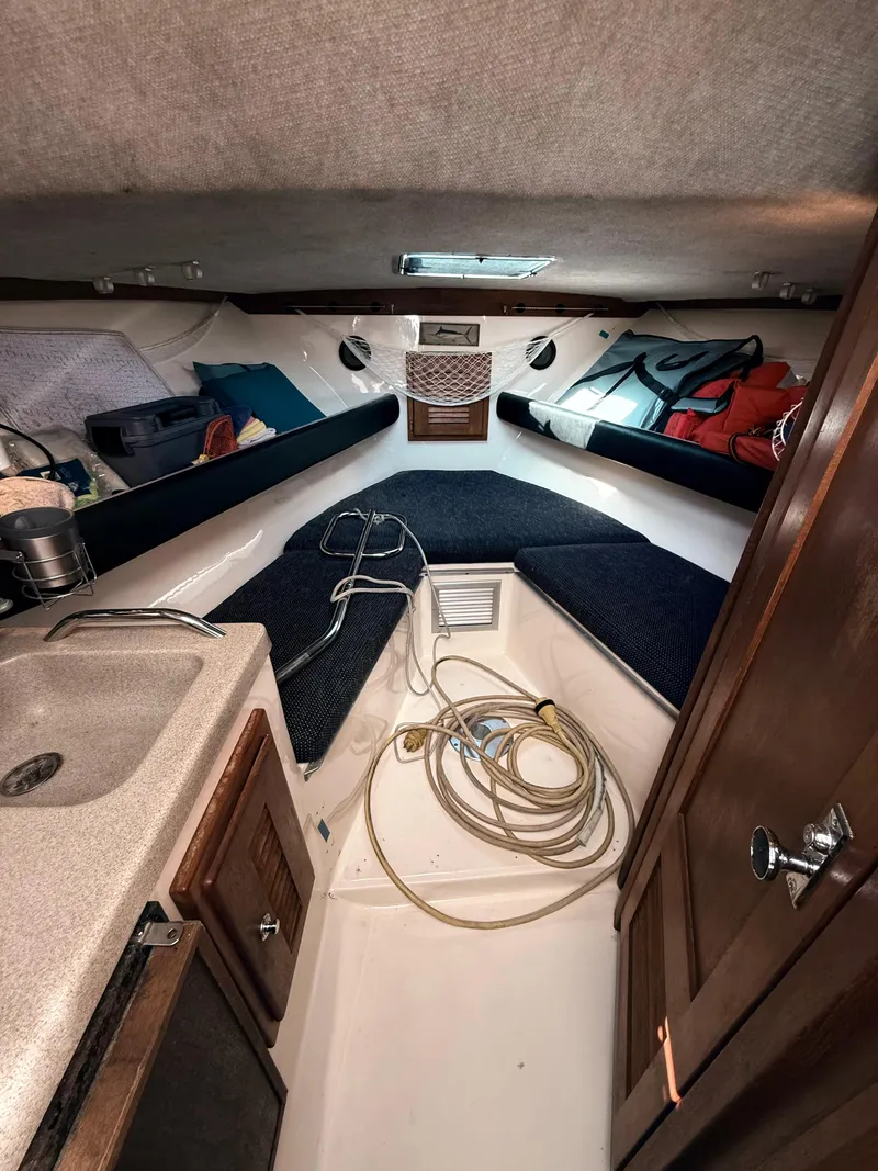 Slide: The Image of 2001 Albemarle 280 Express Sport Fisherman cabin interior with sink and storage. - 27