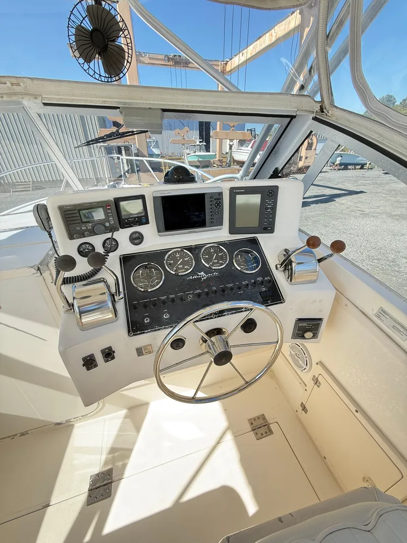 Slide: The Image of 2001 Albemarle 280 Express Sport Fisherman cockpit with diesel power, featuring navigation instruments. - 28