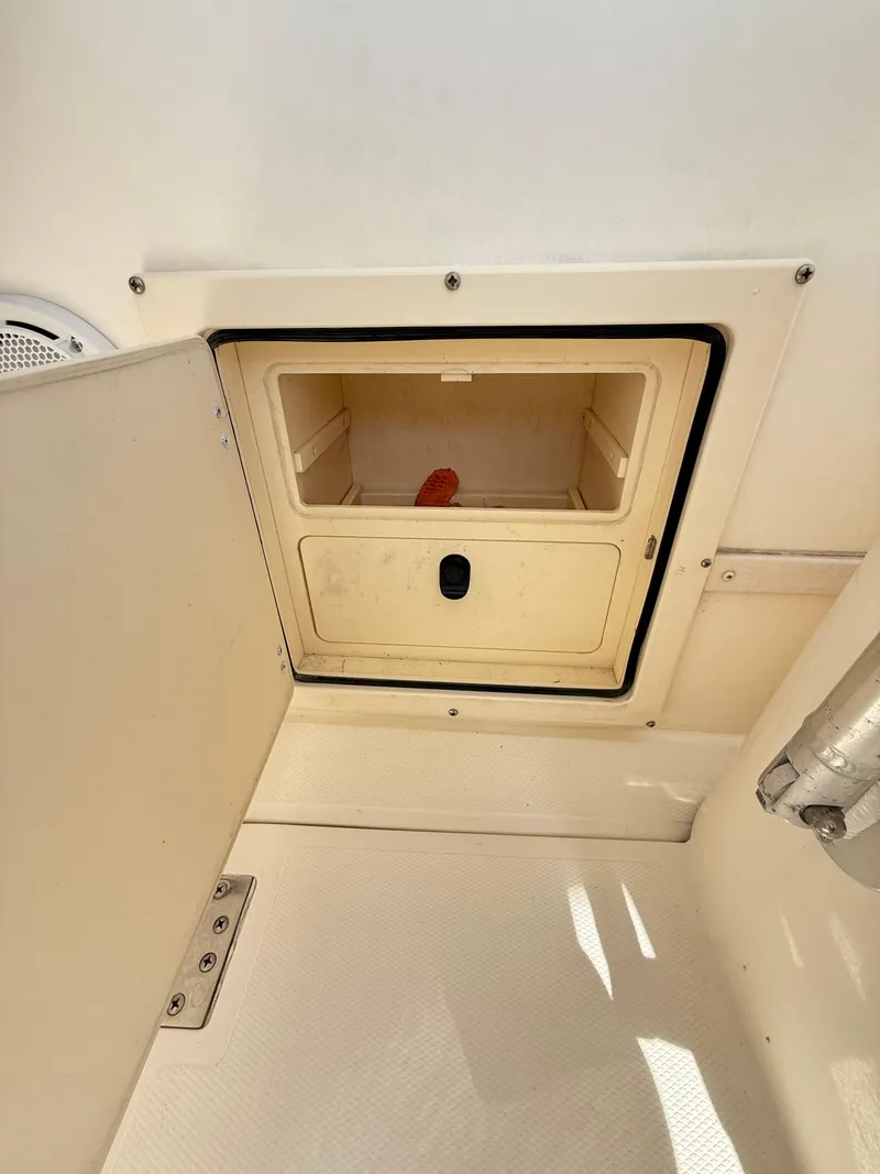 Slide: The Image of 2001 Albemarle 280 Express Sport Fisherman storage compartment with open hatch. - 38