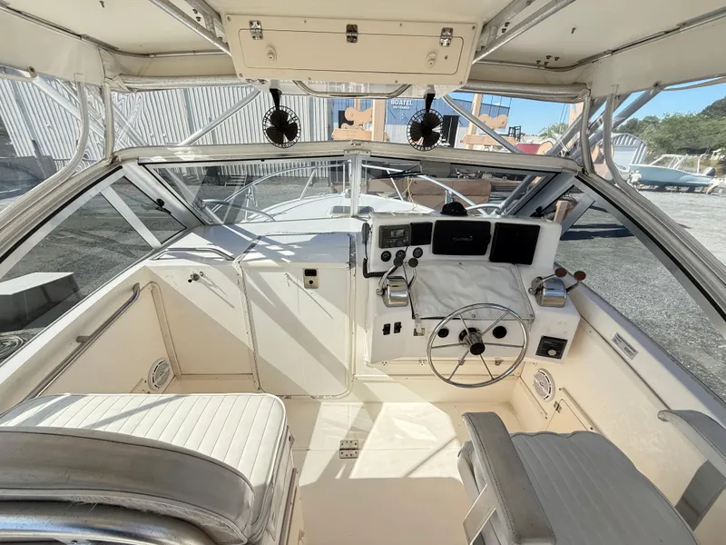 Slide: The Image of 2001 Albemarle 280 Express Sport Fisherman cockpit with steering wheel and navigation equipment. - 6
