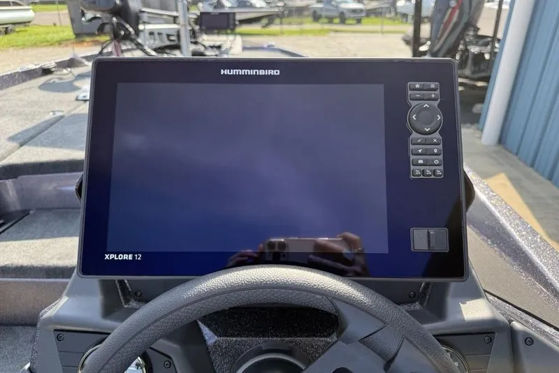 Slide: The Image of Dashboard of a 2026 Skeeter ZXE20 boat featuring a Humminbird Xplore 12 display. - 13