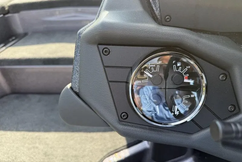 Slide: The Image of Dashboard gauges of 2026 Skeeter ZXE20 boat, showing fuel and trim levels. - 18