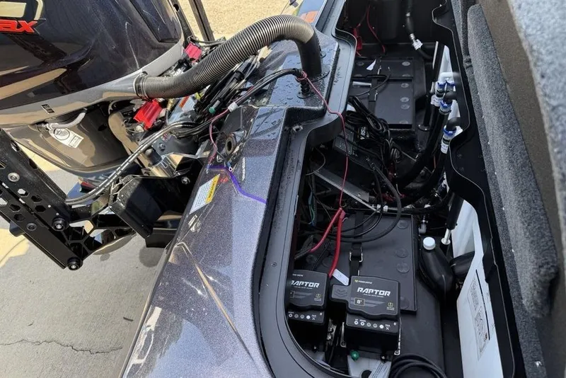 Slide: The Image of 2026 Skeeter ZXE20 boat engine compartment with batteries and wiring. - 23